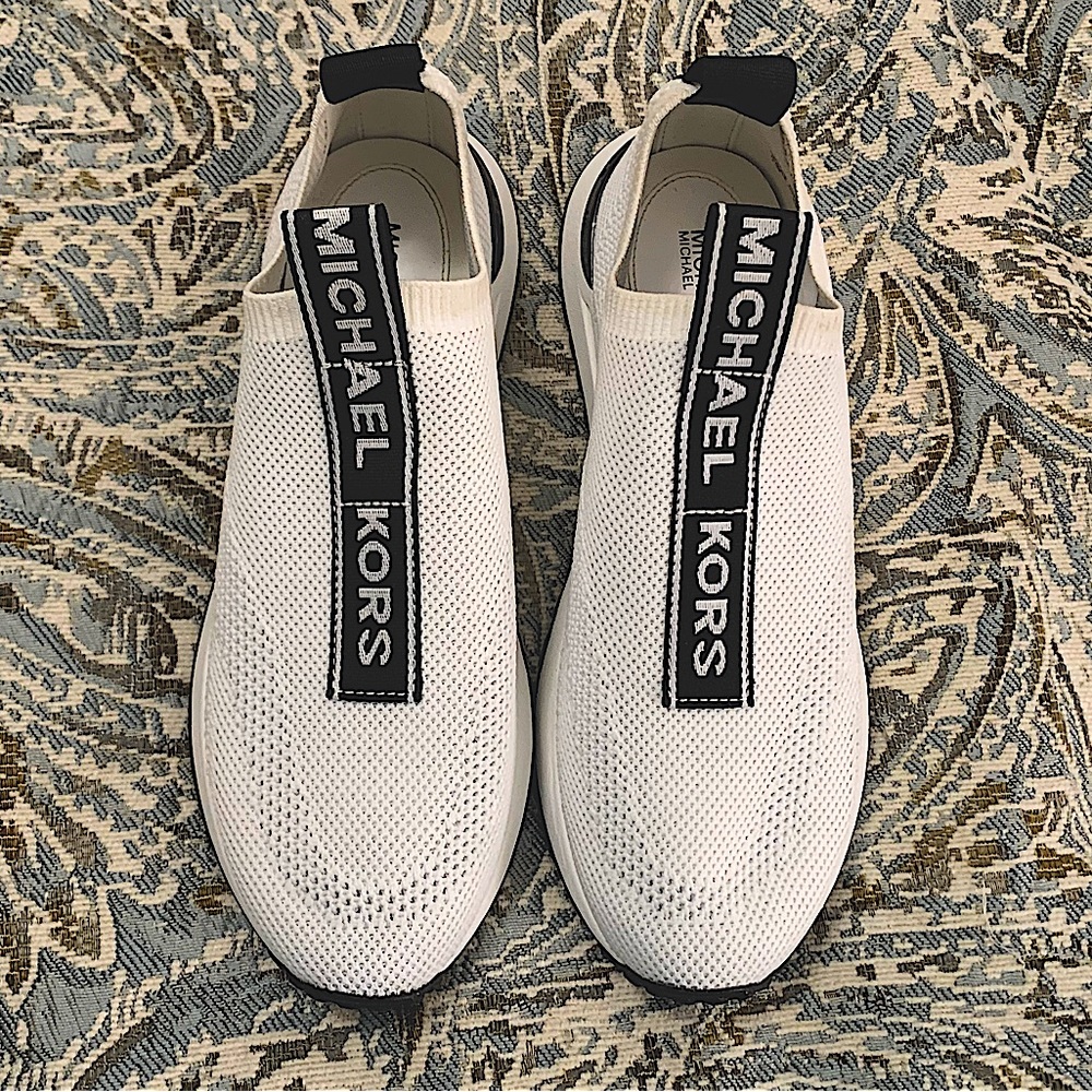 MICHEAL Micheal Kors athletic shoes, white with black trim, size 7.5 in US wmns.